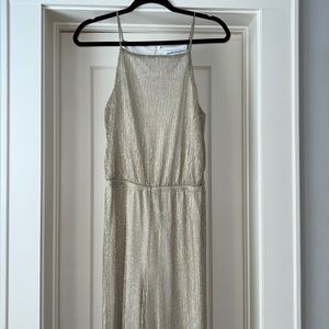 Gold jumpsuit. Size small. Never worn - great condition.